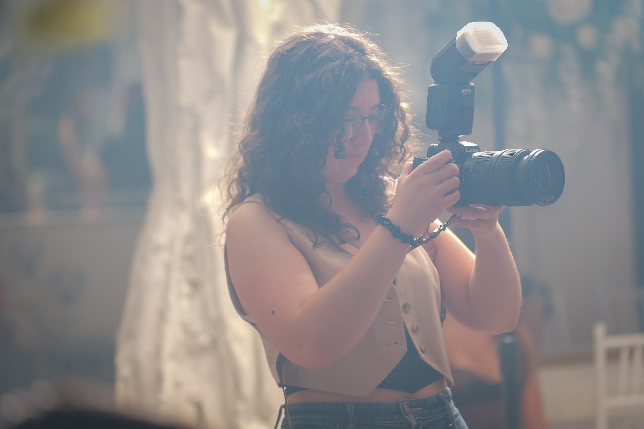 Angela reviewing a shot during an event